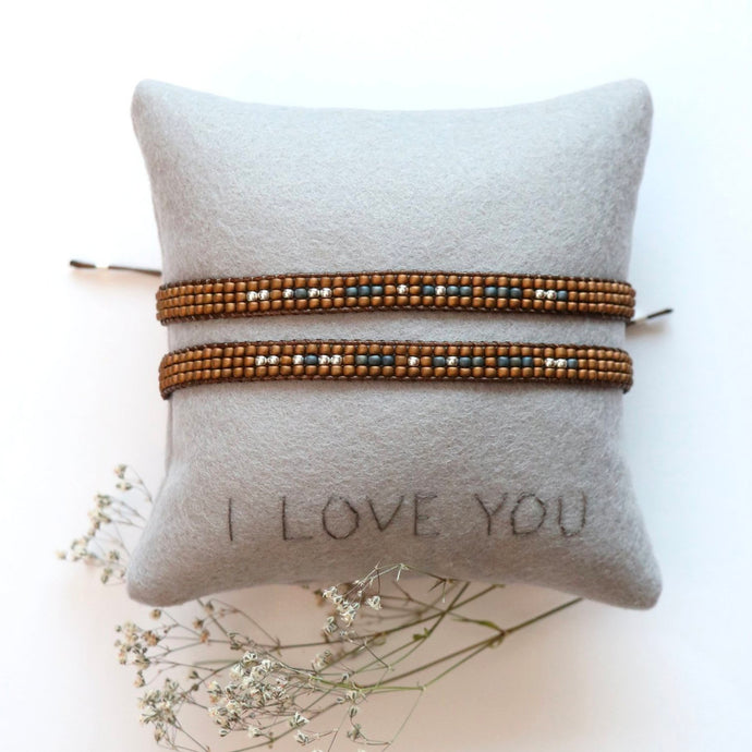 His and Hers Morse Code Bracelet on a small I love you pillow